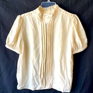 Bourke crème blouse with ruffle collar & side buttons